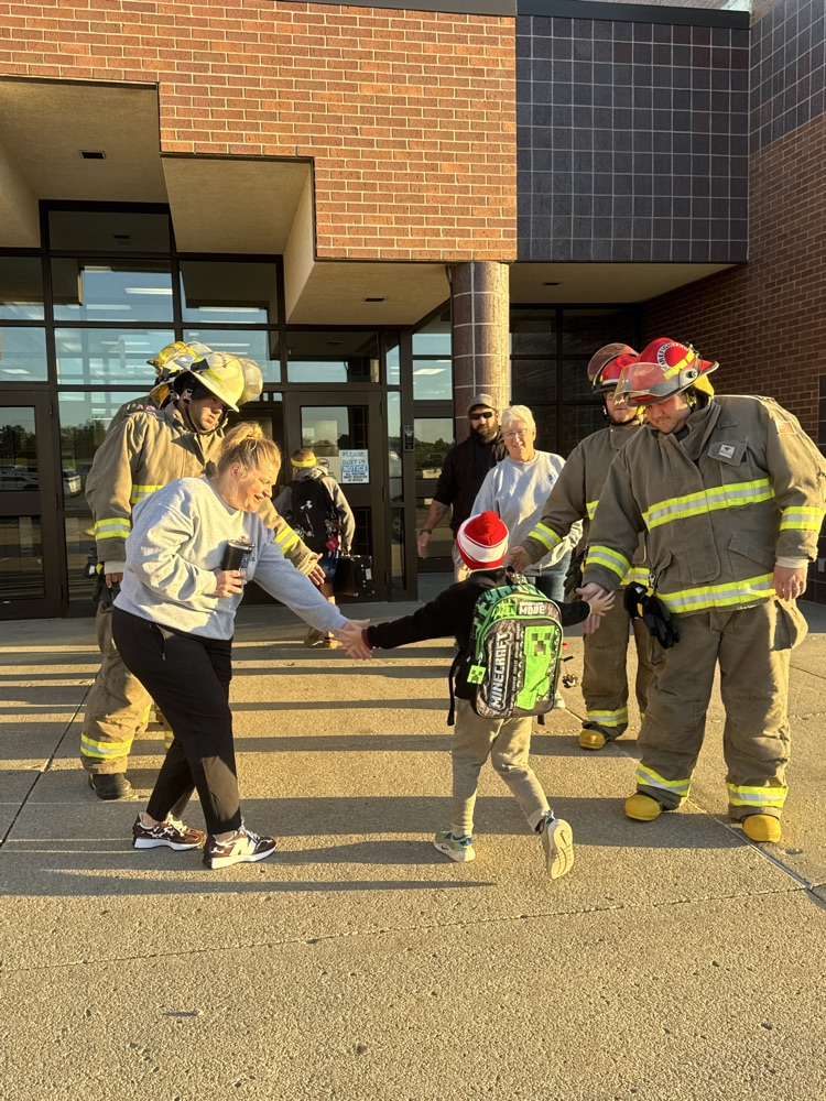 Crofton Volunteer Fire Department and EMS giving high fives to students