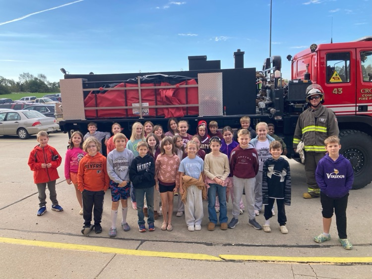 Students posing with members of the Crofton Fire Department and EMS