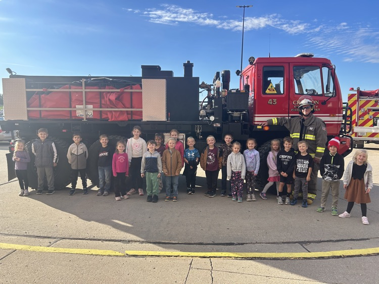 Students posing with members of the Crofton Fire Department and EMS