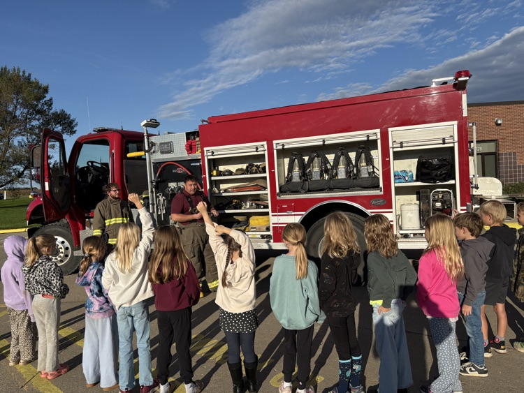 Students listening to a Crofton Fire Department member share information about their job