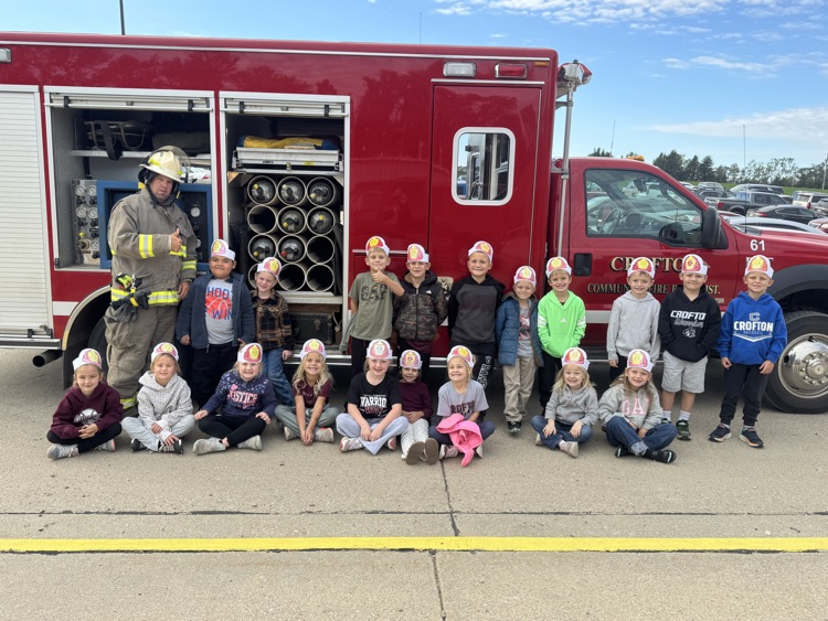 Students listening to a Crofton Fire Department member share information about their job