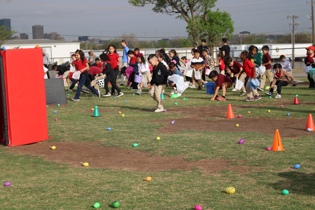 Children running to gather eggs