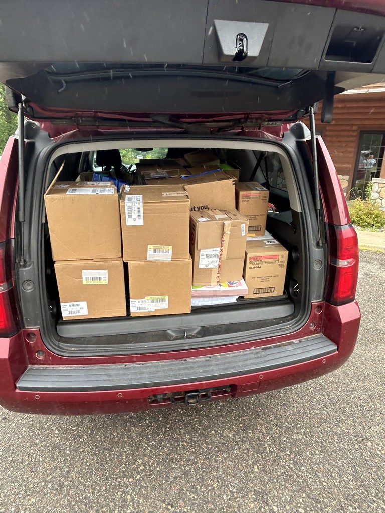 trunk full of boxes of school supplies