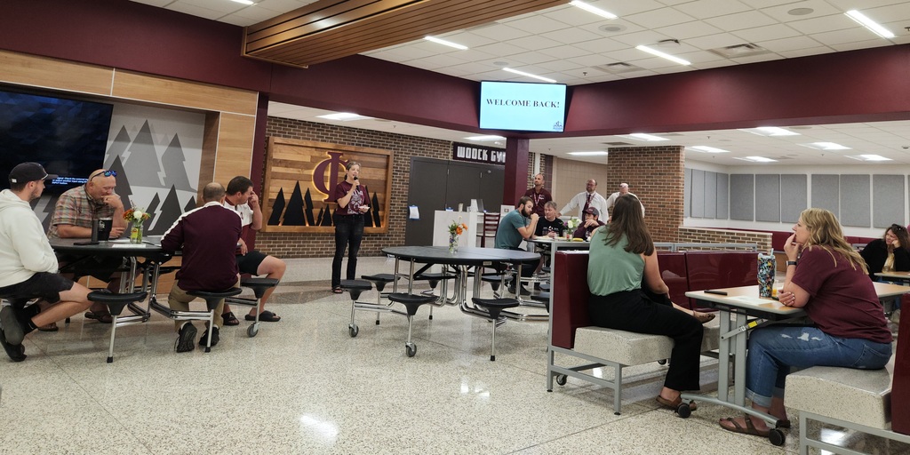 Janel Lewandowski talking to staff