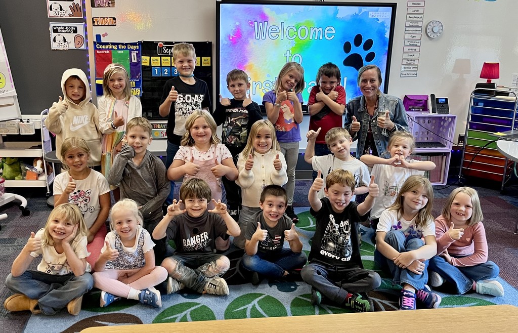 Ms. Esse's class giving thumbs up for the first day of school