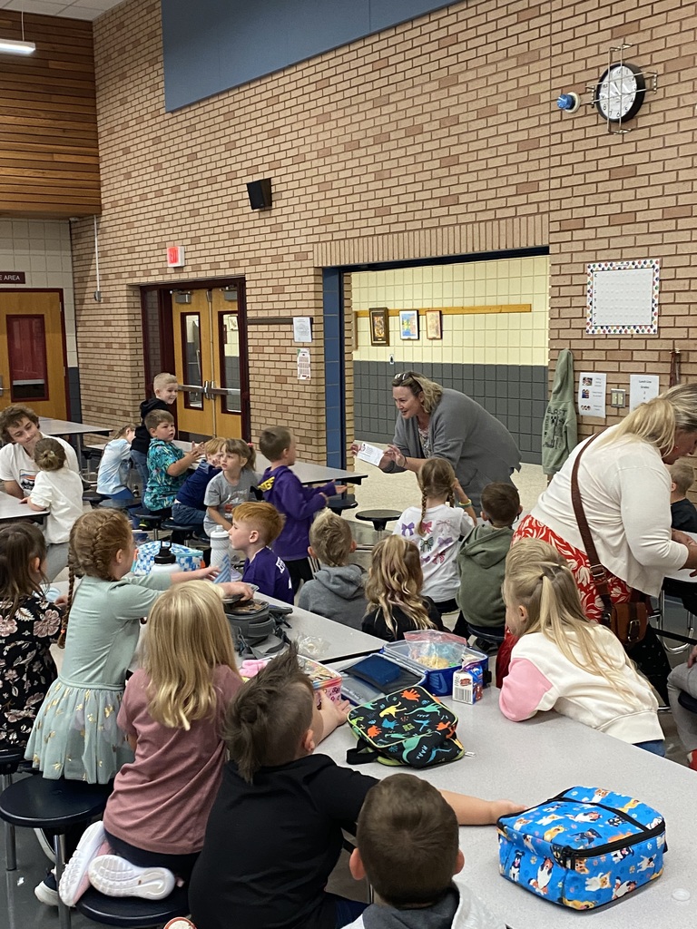 students and teachers in the lunch room