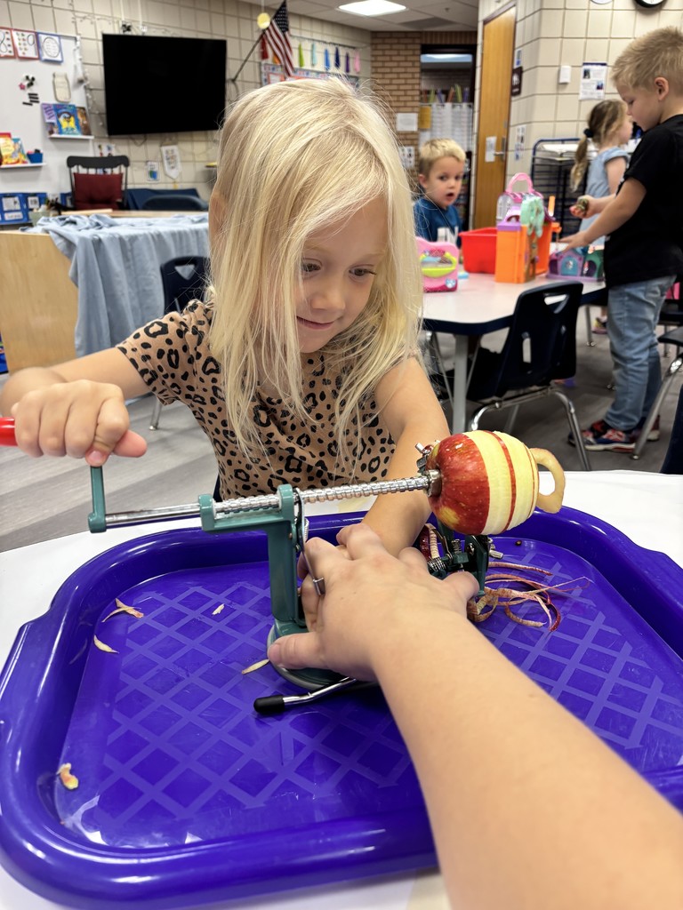 a female student coring an apple