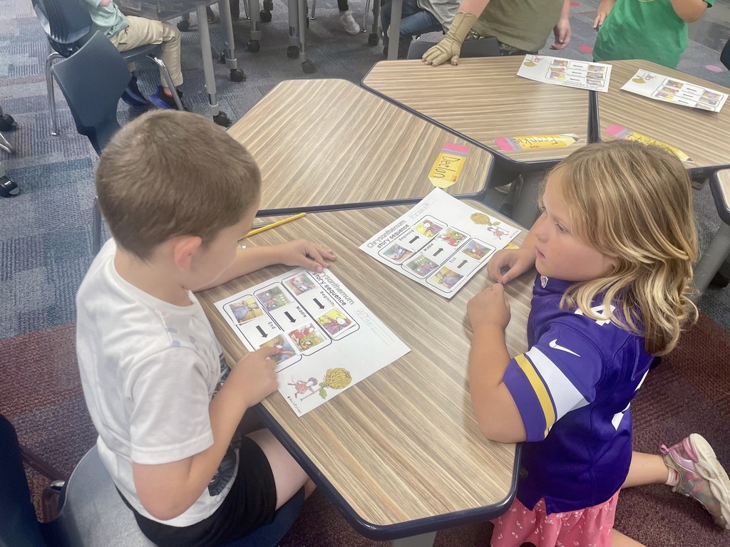 two students telling each other stories