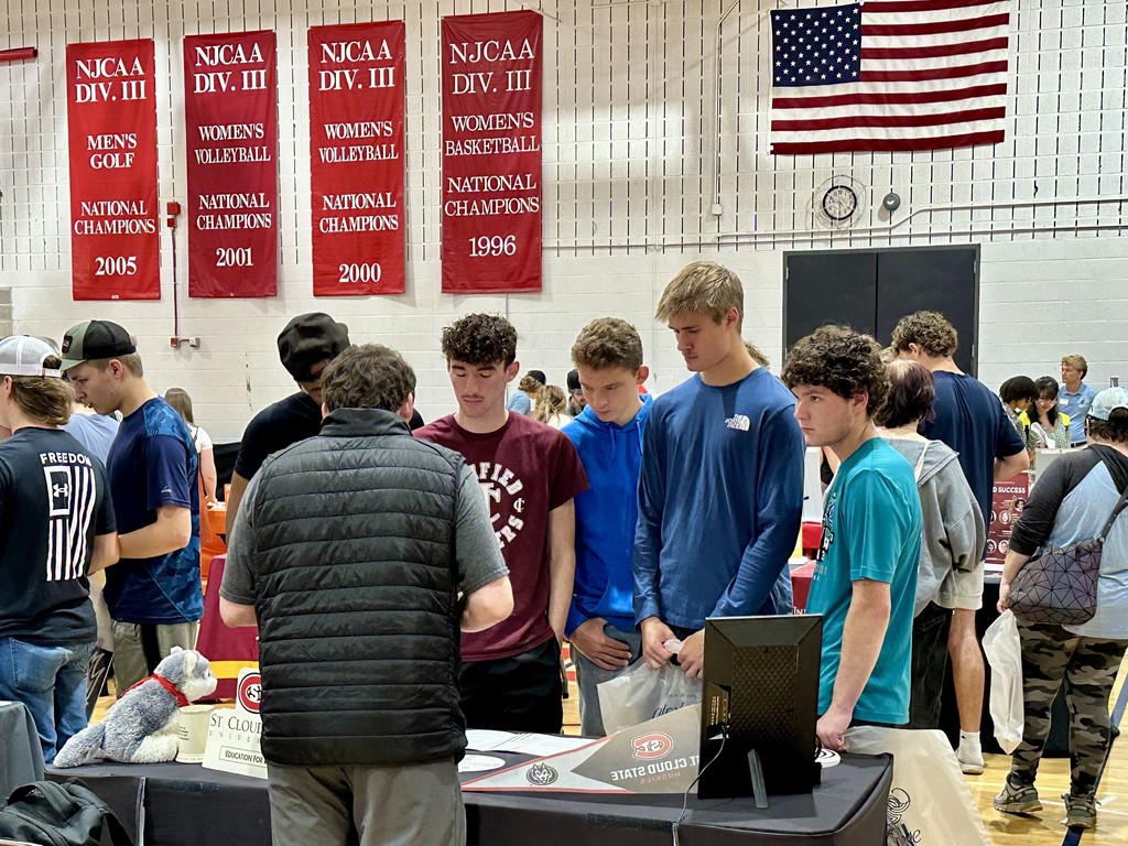 CI senior boys talking to a college at CLC