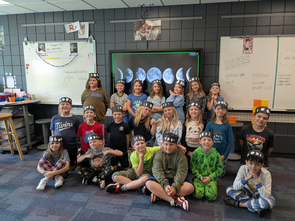 students wearing moon phase hats