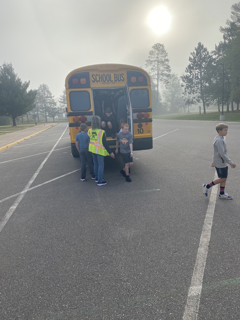 students getting taught how to exit the bus in an emeregency