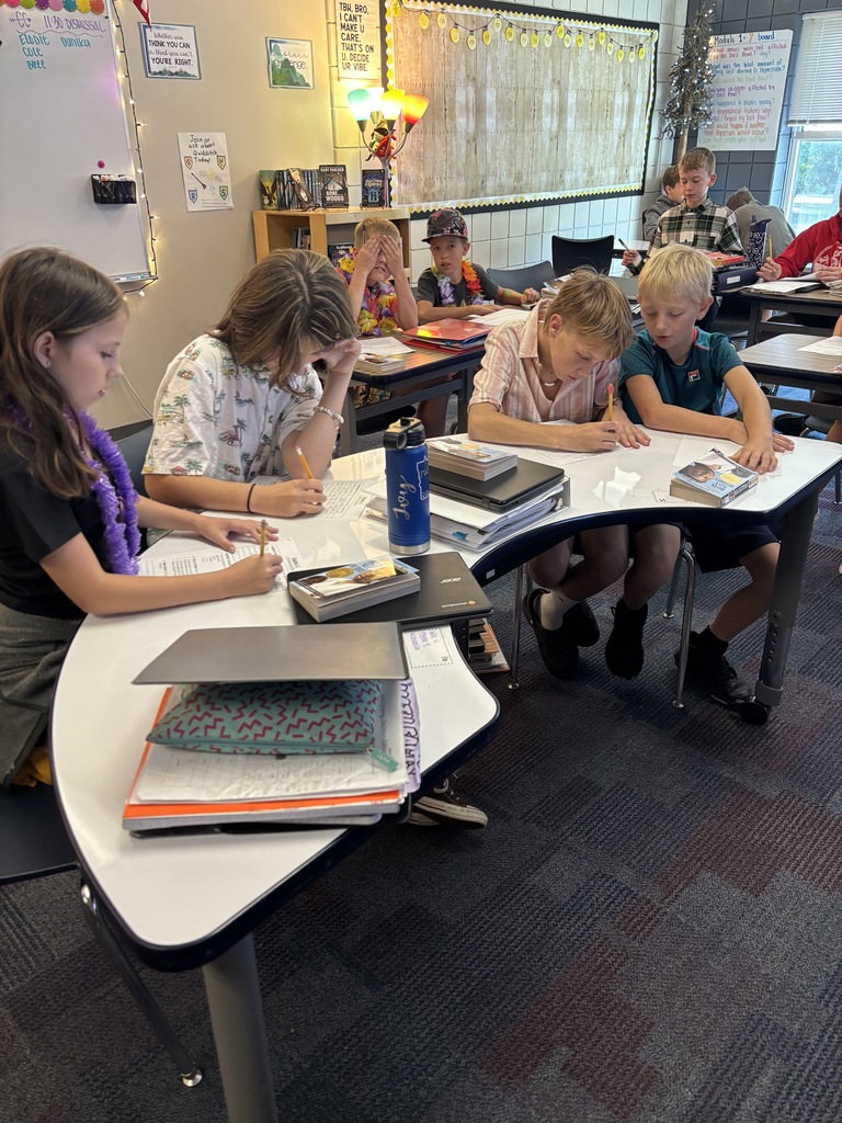ELA students working together on their worksheets