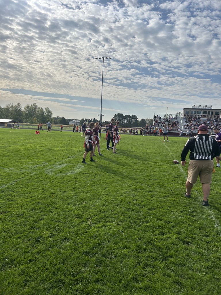 special olympics and unified partner in pillager playing flag football