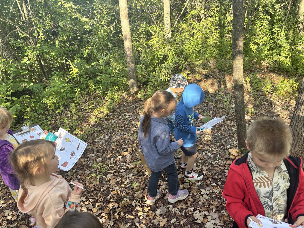 preschoolers walking on the trail on a scavenger hunt