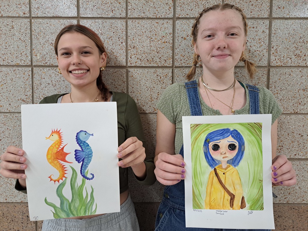 Two female students who painted seahorses and a girl with watercolors