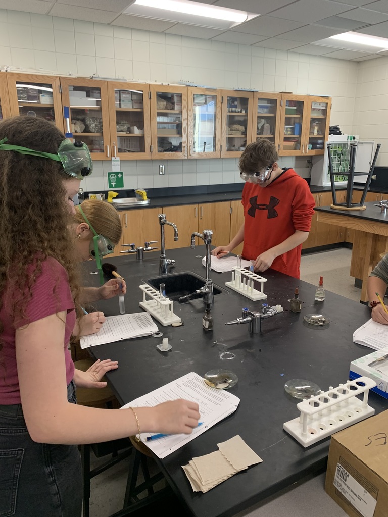 multiple students working on their lab worksheets