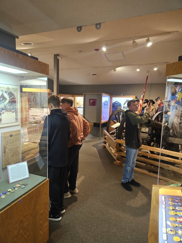 Students walking around the history museum at Camp Ripley