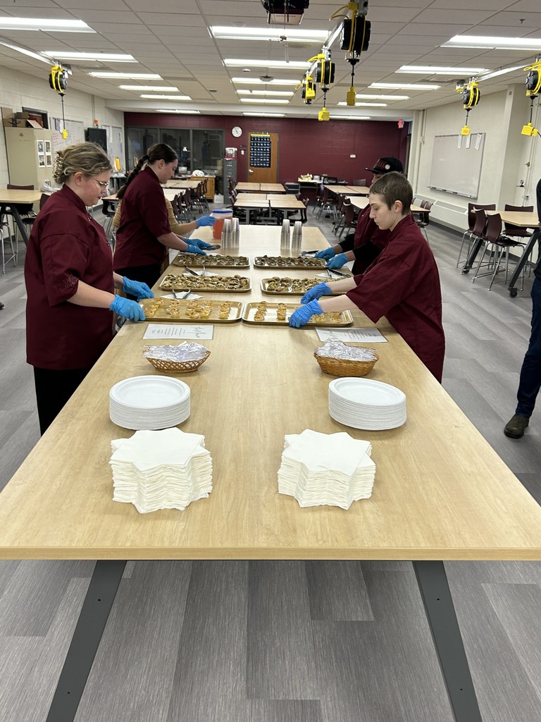 Culinary student setting up the food for BAH