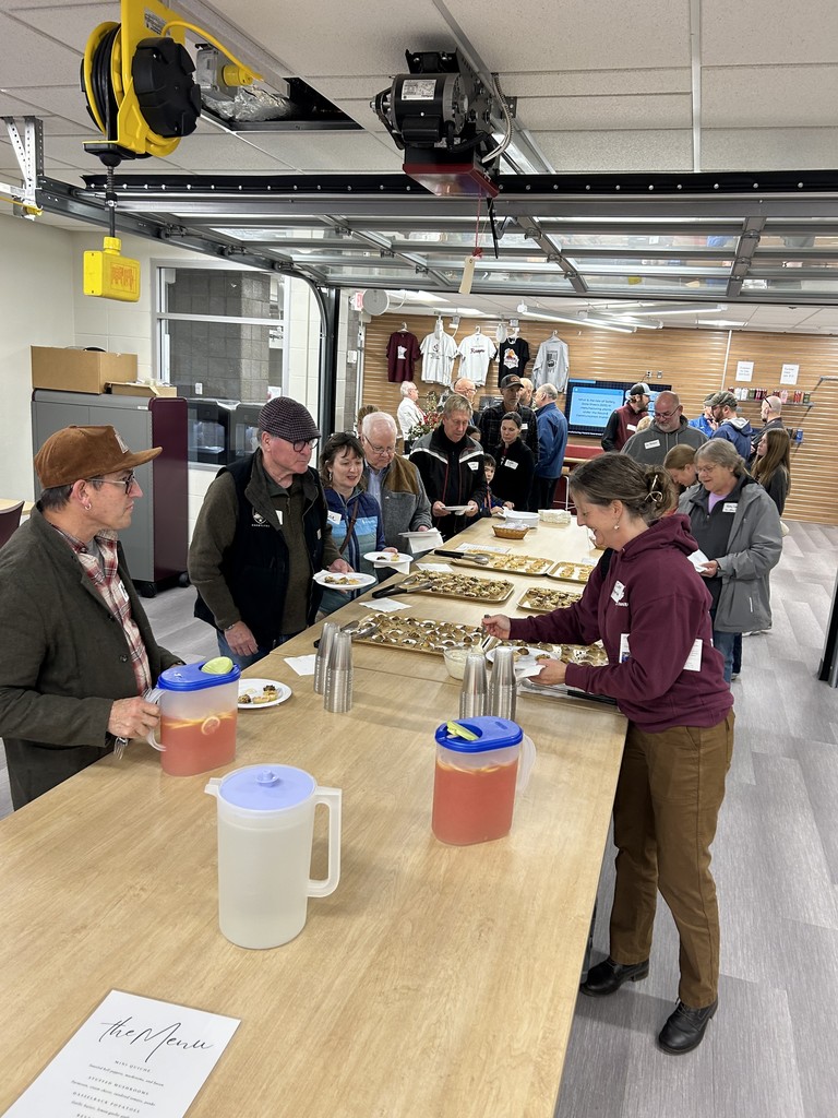 community member filling their plates at business after hours