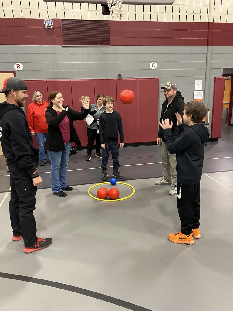 students playing a game with adults during the 5th grade expo
