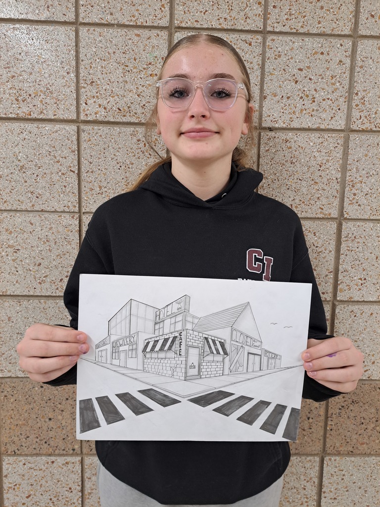 Female student holding a 2-point perspective drawing