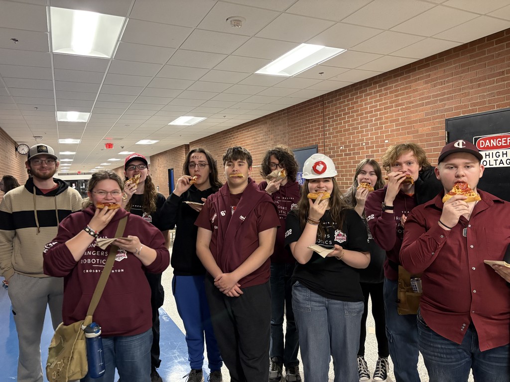 Robotics students eating pizza