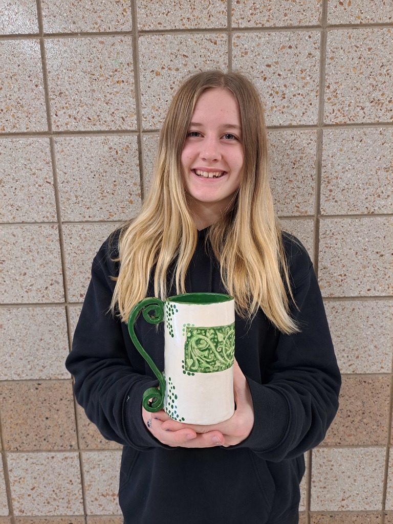 Kylie holding a 3D stamped mug