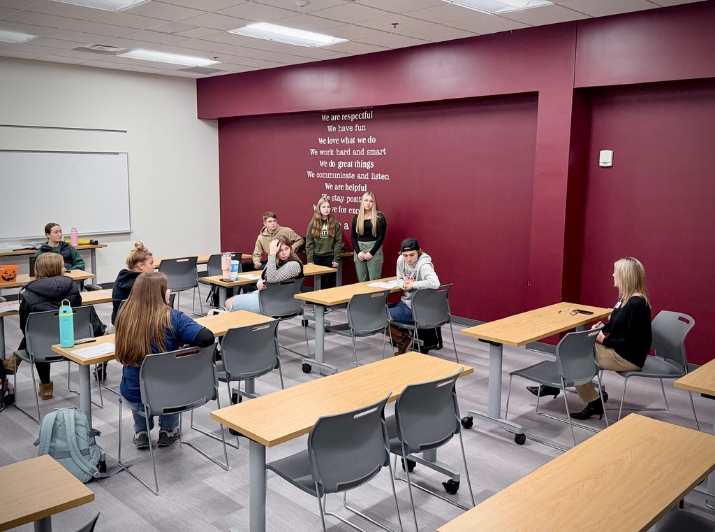 a hospital worker speaking to students about healthcare occupations