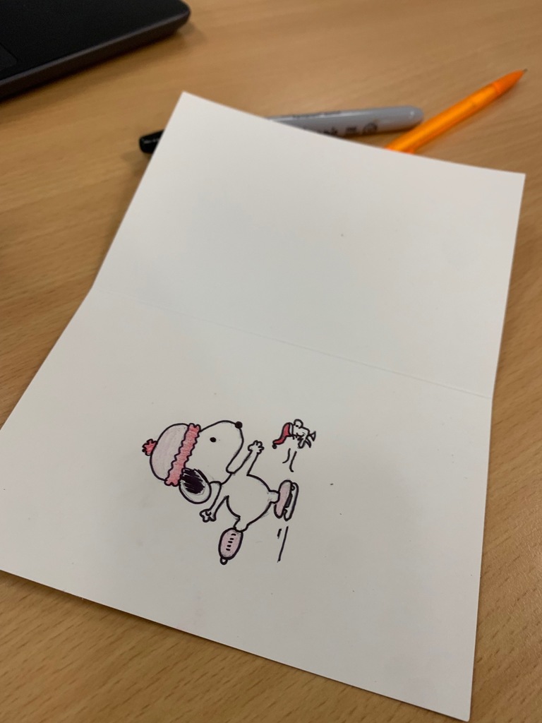 Holiday for Heroes card with Snoopy ice skating on it