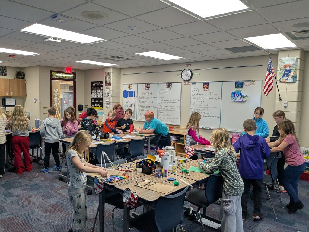 3rd and 4th grade combo class working at their desks on different cultural celebrations 
