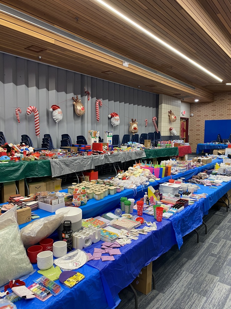 photo of all the tables set up with gift items at Jingle Bell Lane