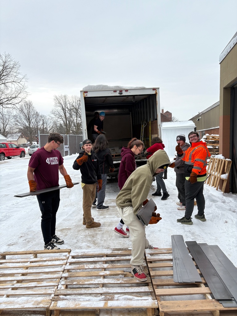 students in Ranger Made and welding classes unloading donated steel sheets from Clow Stamping