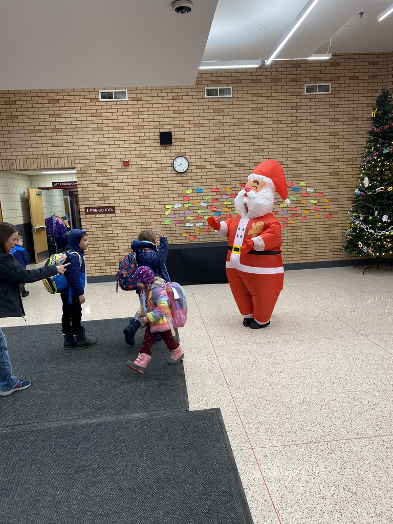 an inflatable santa greeting CRES students as they enter school