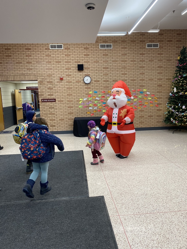 inflatable santa greeting more students as they enter CRES on the last day before break
