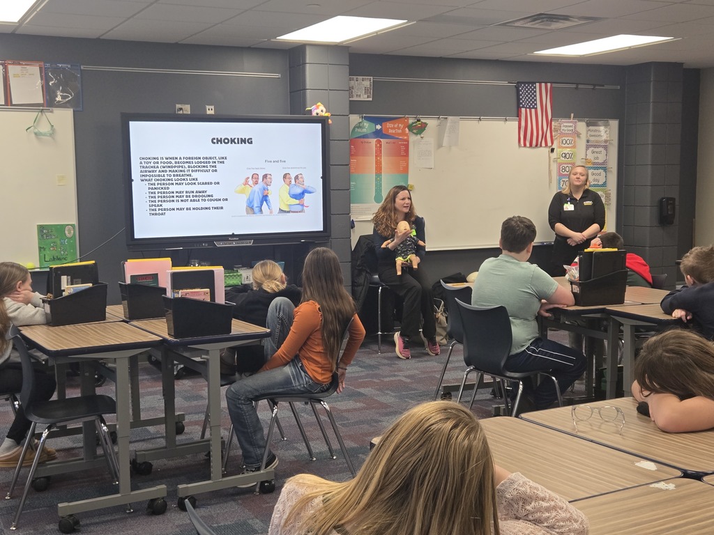 CRMC staff showing 5th graders how to help a choking baby