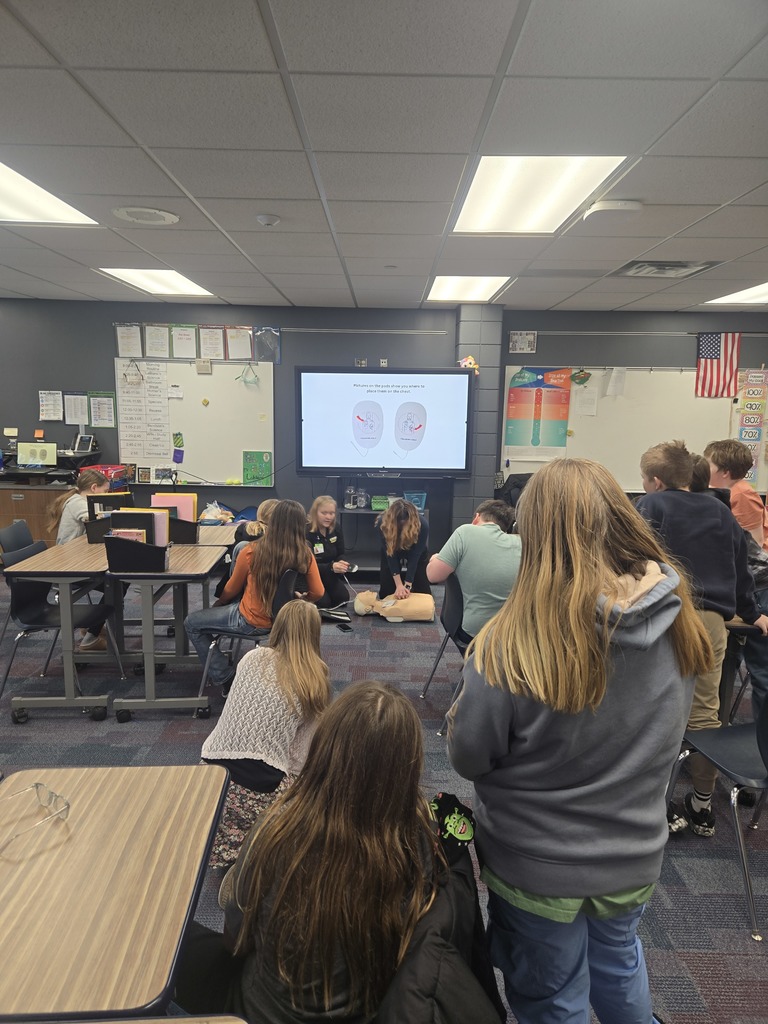5th grade students watching CRMC staff show them how to do CPR