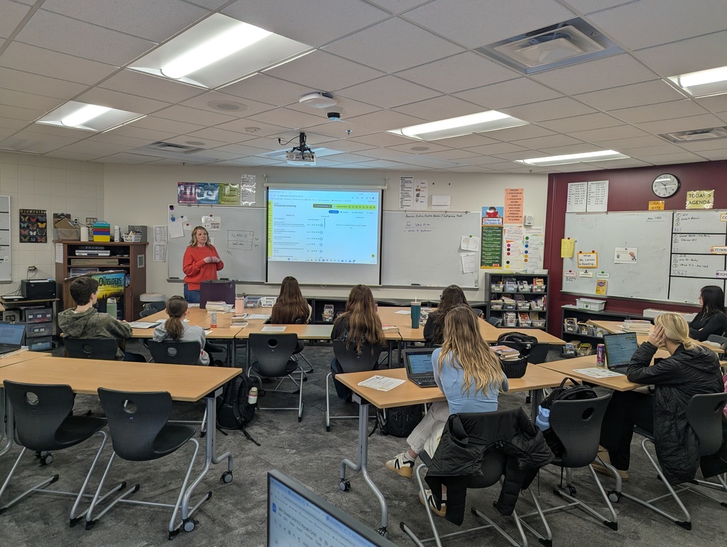 students listening to Mrs. Doyle talk about scholarships and how to apply for them on school lnks