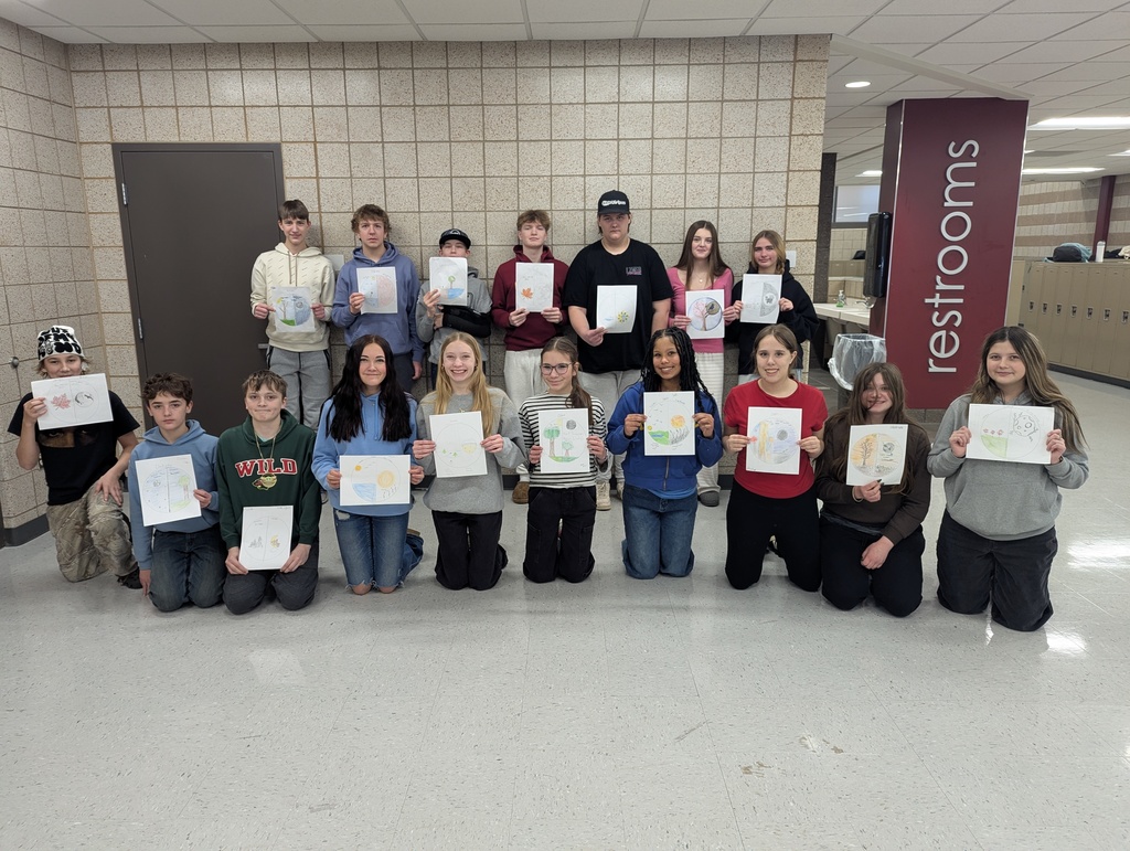 8th graders holding up their birthday moons for their indigenous people unit