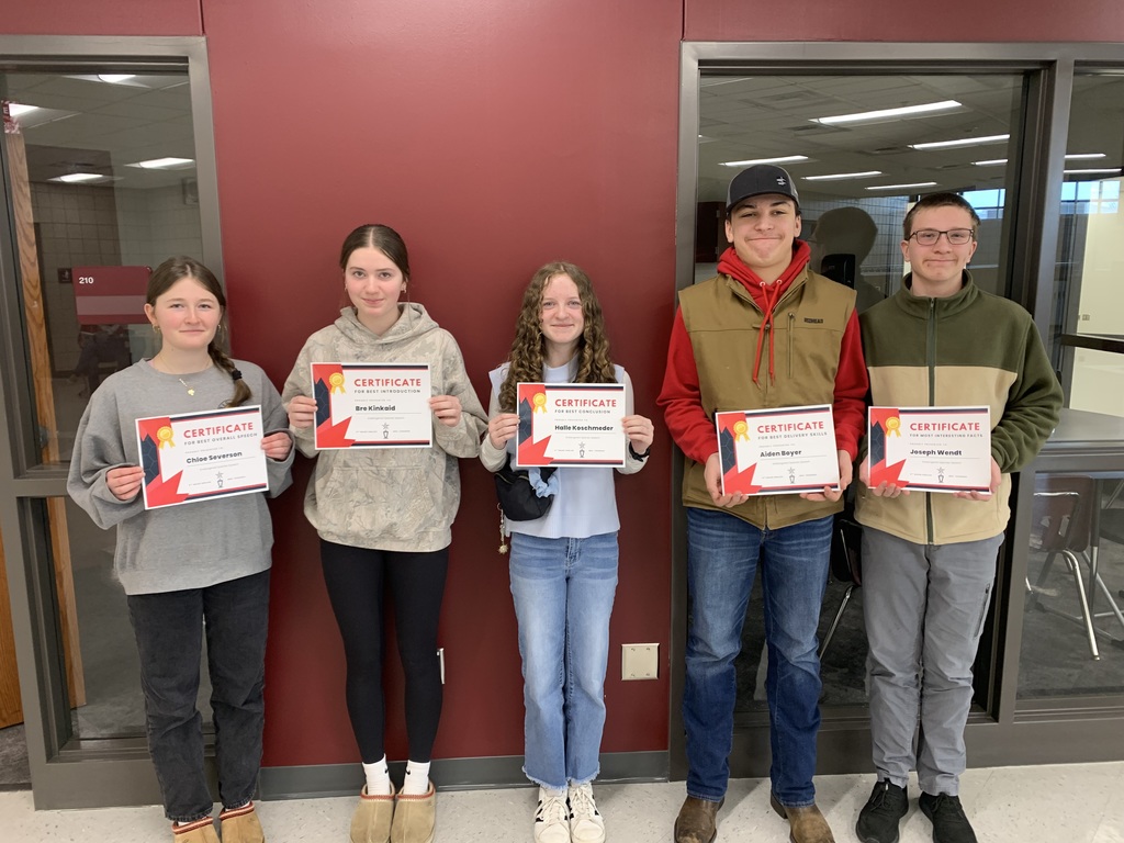 5 9th grade students holding certificates they received as part of their speeches