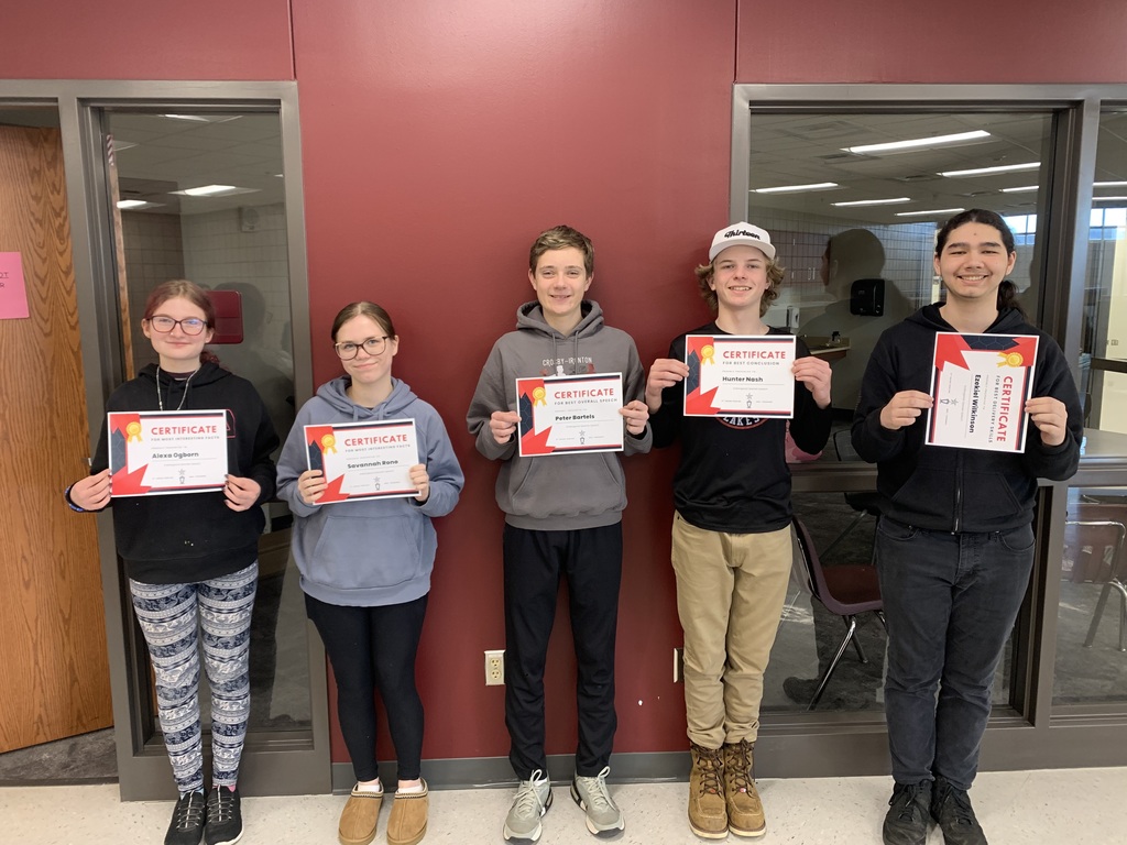 5 9th grade students holding certificates they received as part of their speeches
