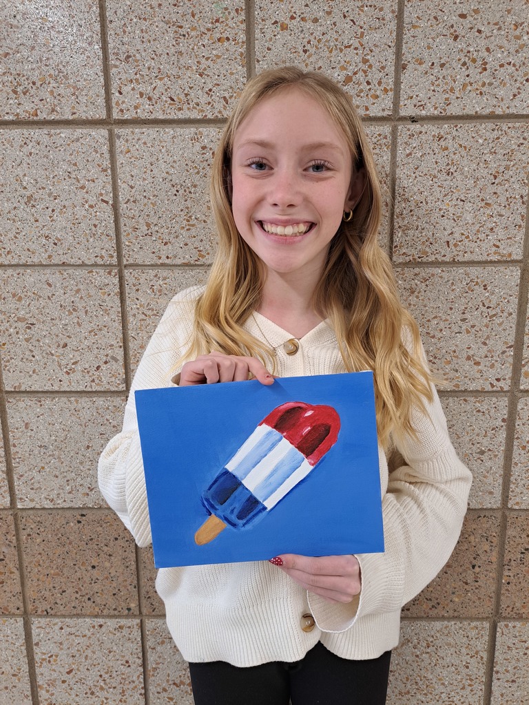 female 7th grader holding a painting of a bomb pop popsicle