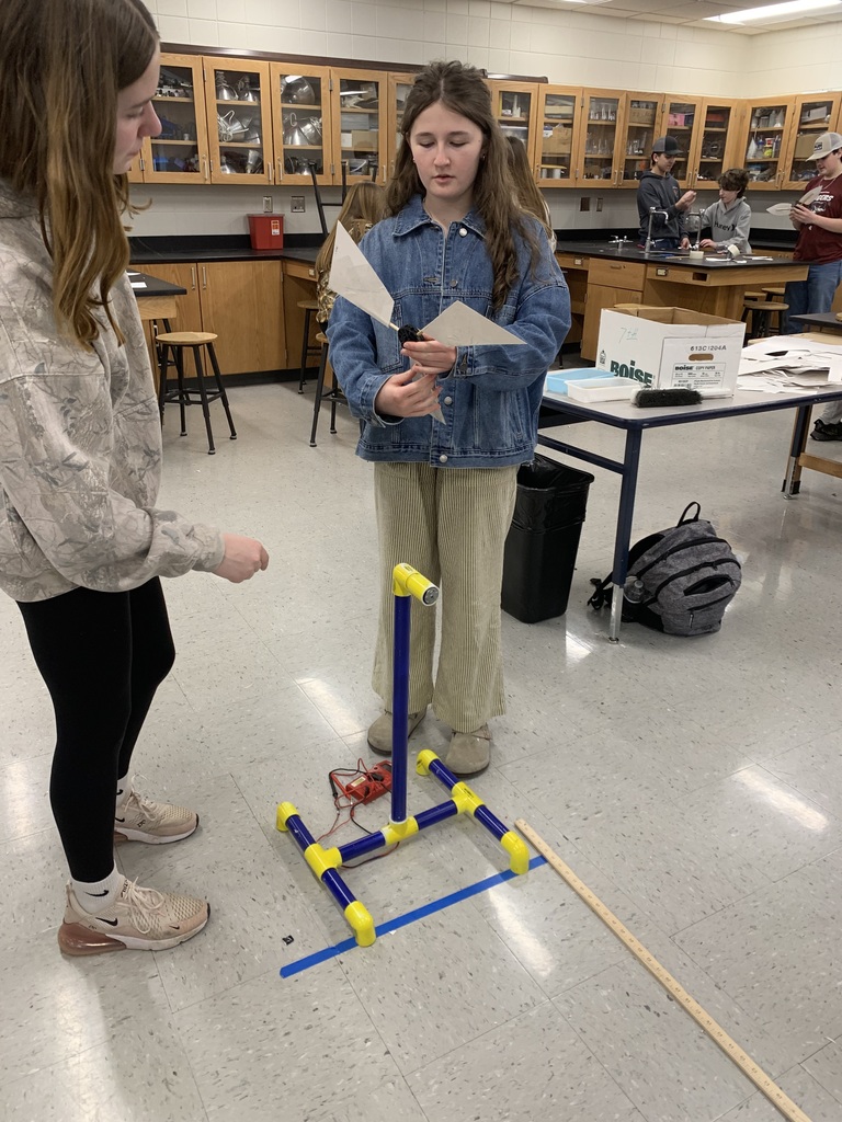 two female 9th grade students working together to build their wind turnbine