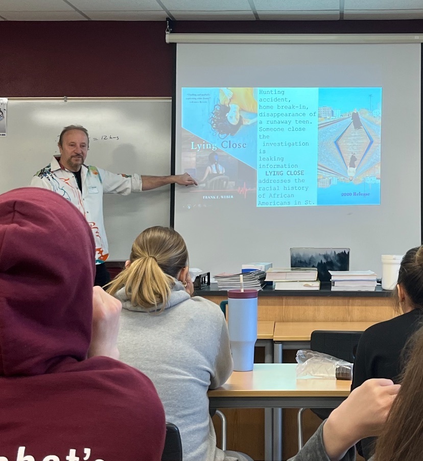 Forensic psychologist showing a slide on the screen to Mr. Gindorff’s class