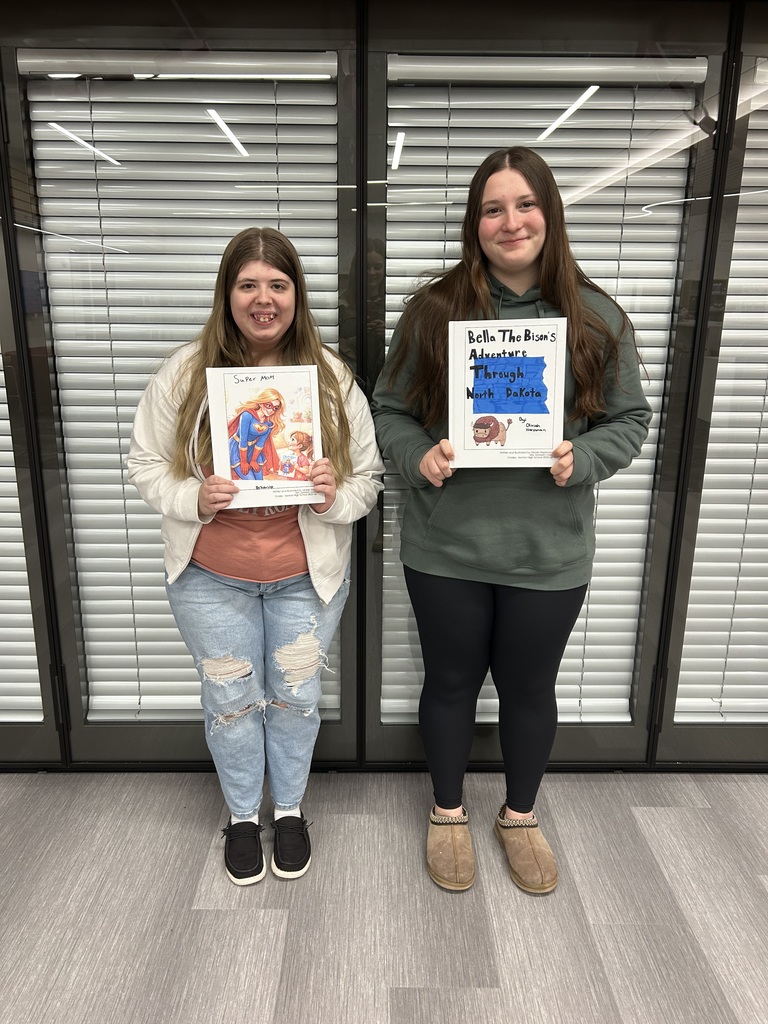 two female students holding books that CLEF helped finance