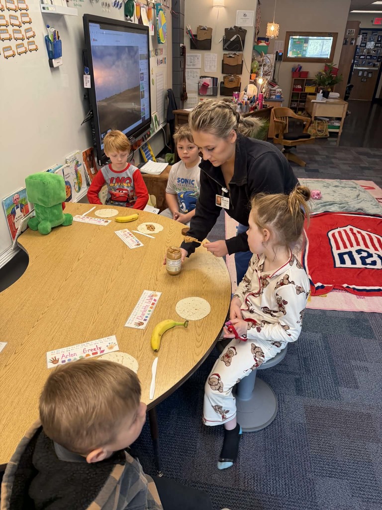 Miranda scopping peanut butter onto a tortilla