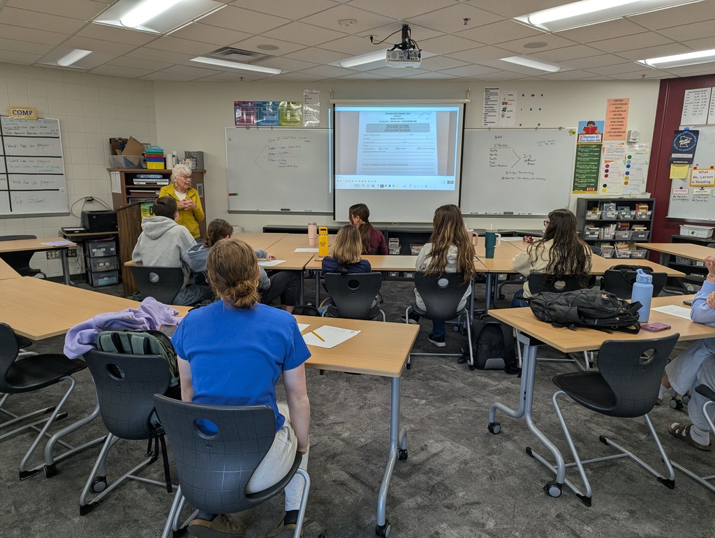 Mrs. Hachey in front of the CIS writing class talking about grant writing and donation letter
