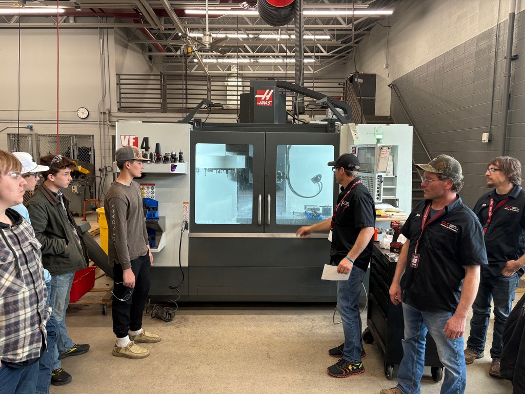 CLC instructors speaking to students in Mr. Schafbuchs class