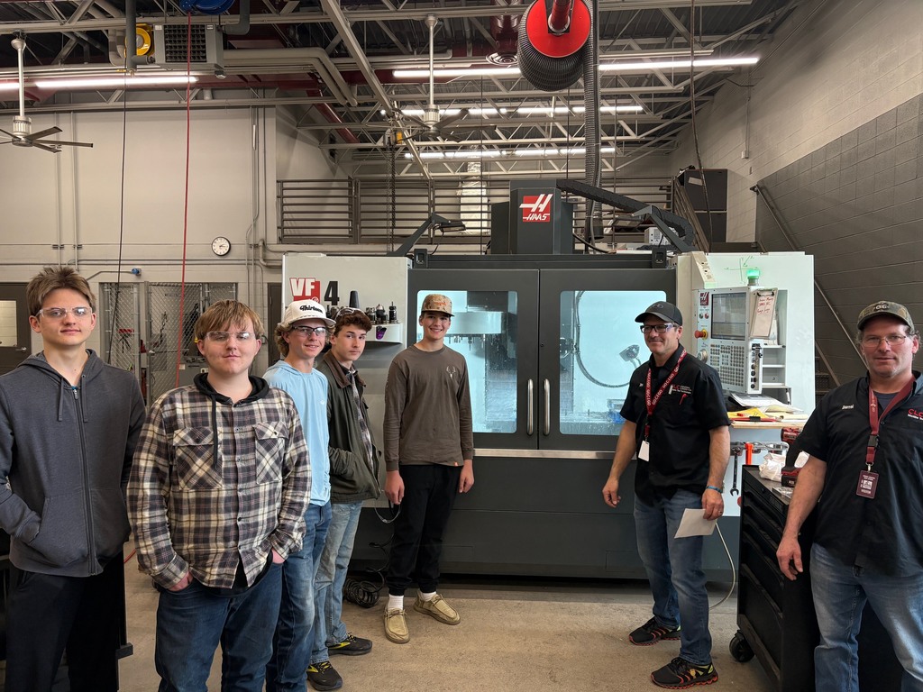5 students and 2 instructors from CLC talking about the CNC mill