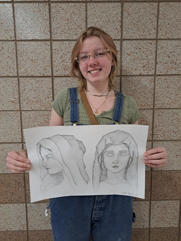 Female student who sketched a profile and forward facing of Mary