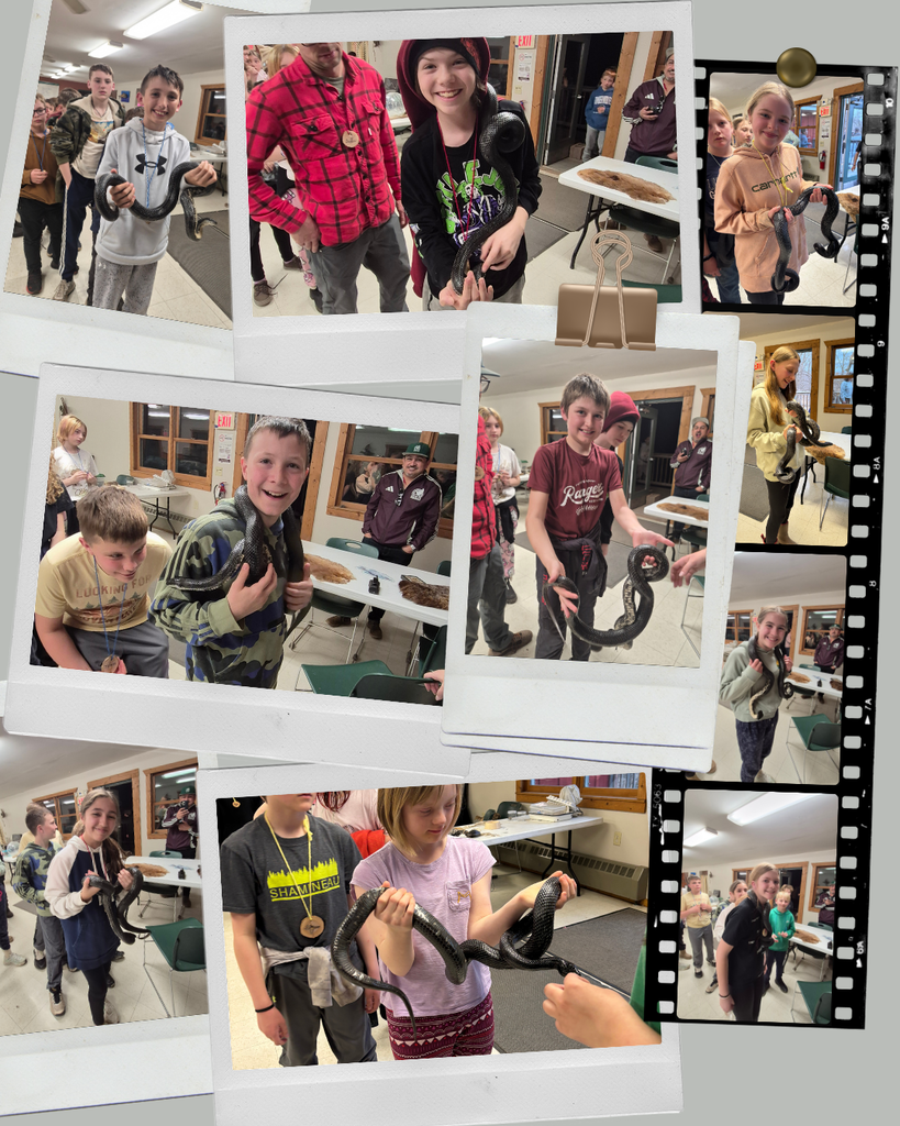 6th grade students at Long Lake holding snakes